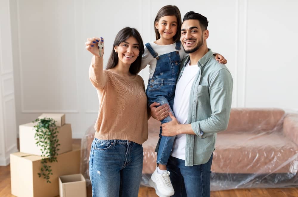 Happy family moving in to new home.